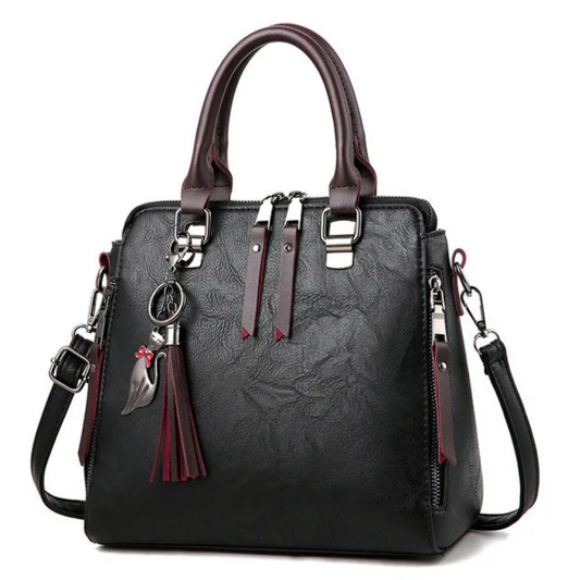 **"Vintage Leather Women's Handbag"**  
Handpicked for Tye Meshun's boutique, this stylish vintage-inspired handbag features a tassel accent and versatile design. Use it as a tote, satchel, crossbody, or shoulder bag. Combini