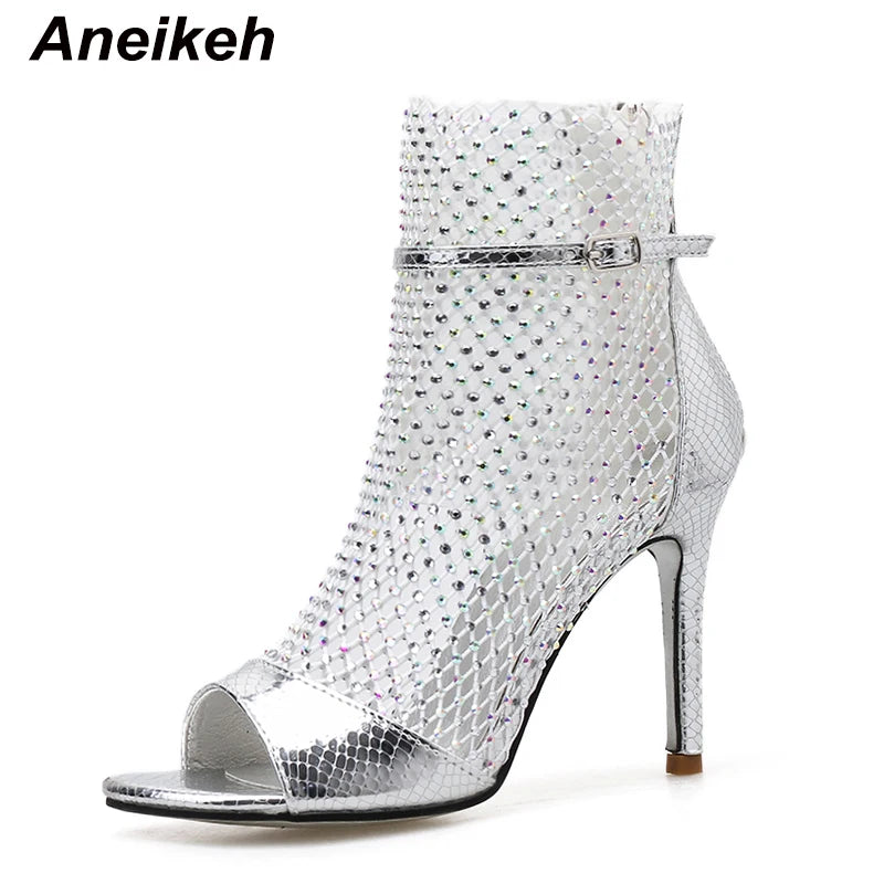 Discover the Aneikeh Glitter Gladiator Sandals: a stunning pair of high-heeled, peep-toe pumps that blend sexiness with comfort, thanks to their airy mesh design and sleek, thin heels.