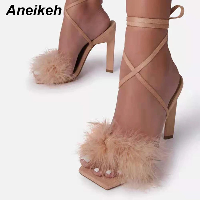 Discover the allure of Aneikeh Rome's fashion-forward furry cross-tied pumps. These women's sandals feature a seductive thin high heel and a lace-up design that exudes elegance and style.