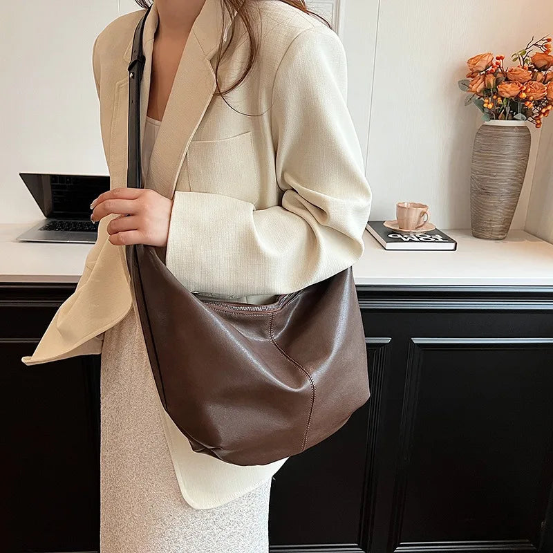 **"Chic Underarm, Messenger & Satchel Bag"**  
Curated for Tye Meshun's Boutique, this versatile square bag is perfect as a shoulder, satchel, or travel handbag. With a spacious interior and trend-forward design, it’s the u