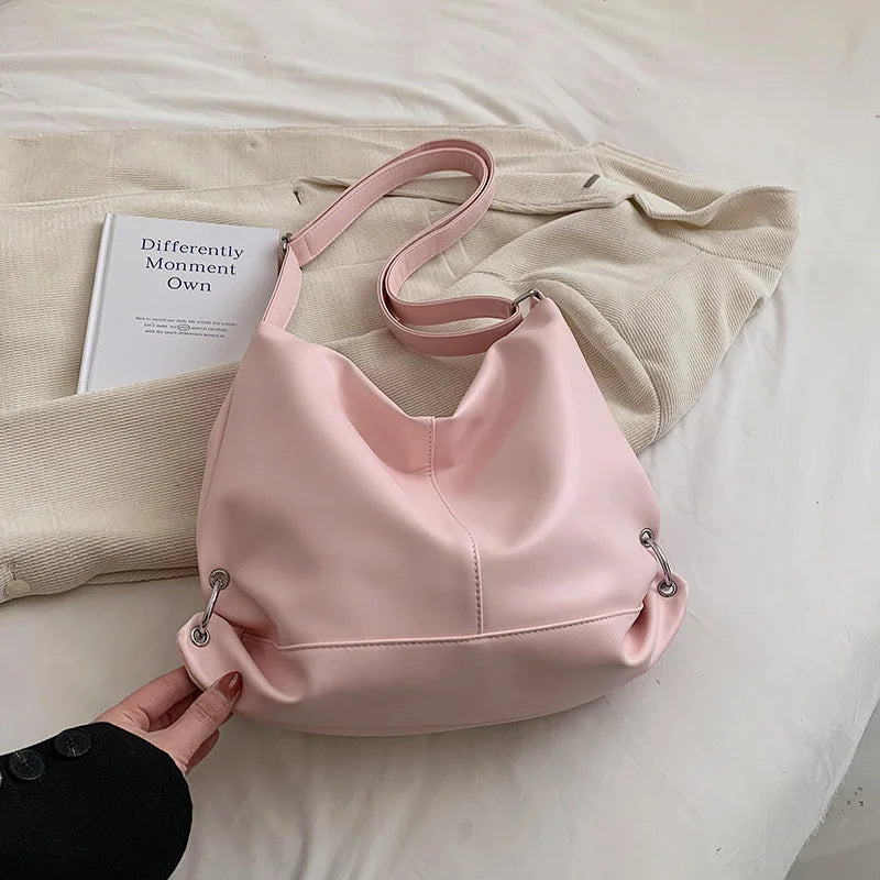 **"Textured Soft Leather Handbag – Pink Crossbody Tote"**  
Add a pop of personality with Tye Meshun's textured soft-leather handbag. Featuring a spacious interior and a versatile crossbody strap, this pink tote effortlessl