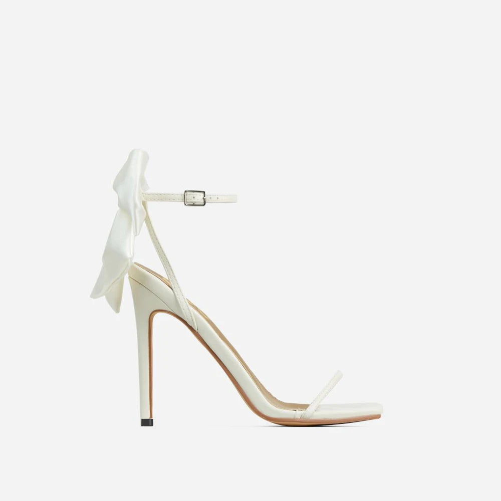 Discover the charm of Aneikeh Butterfly-Knot Sandals! With their sleek square toe, slender heels, and a minimalist yet sweet buckle strap, these open-toe sandals are the epitome of elegance. The pleated design adds a touch of