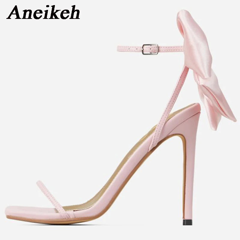 Discover the charm of Aneikeh Butterfly-Knot Sandals! With their sleek square toe, slender heels, and a minimalist yet sweet buckle strap, these open-toe sandals are the epitome of elegance. The pleated design adds a touch of