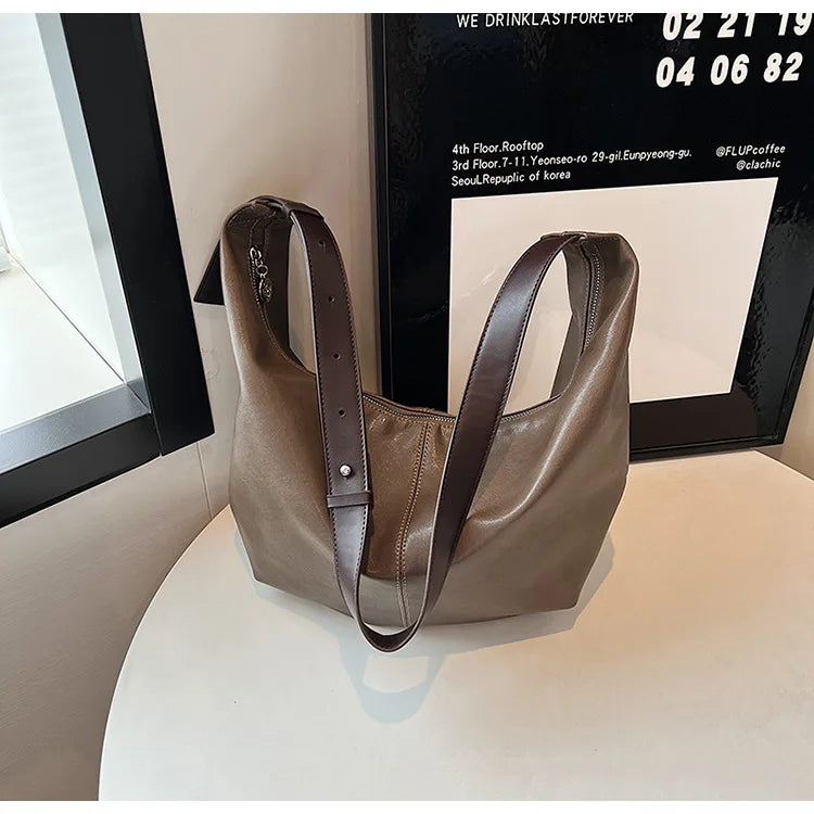 **"Chic Underarm, Messenger & Satchel Bag"**  
Curated for Tye Meshun's Boutique, this versatile square bag is perfect as a shoulder, satchel, or travel handbag. With a spacious interior and trend-forward design, it’s the u