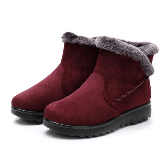 Discover the cozy embrace of YAERNI's Winter Plush Fur Short Snow Boots! These women's ankle boots feature a warm lining, stylish suede exterior, and convenient zipper closure, perfect for braving the cold in style.