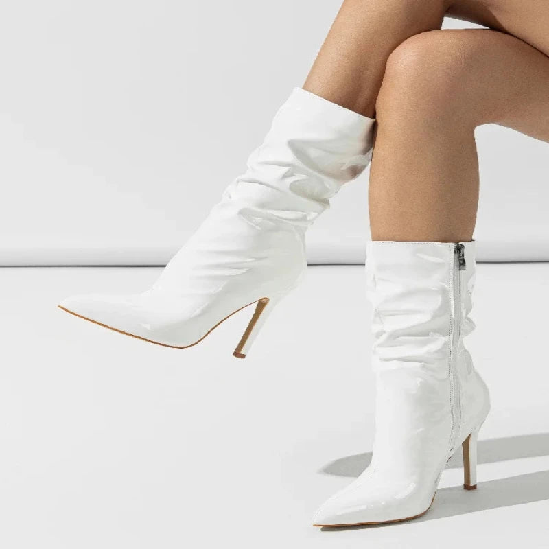 Step into the season with Aneikeh Fashion's sleek patent leather pleated ankle boots. Perfect for women who want to combine style with comfort this autumn and winter, these boots feature a chic pointed toe and slender high he