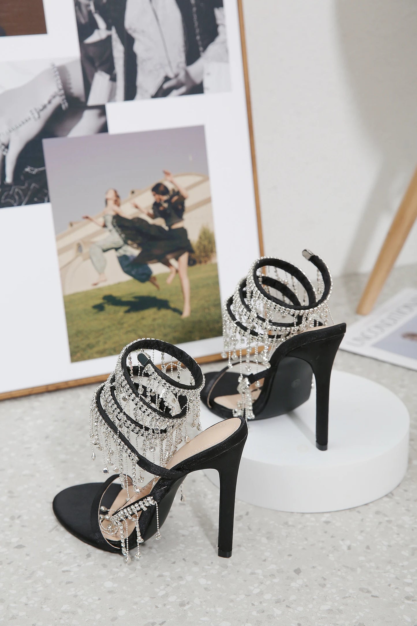 Discover the Aneikeh Fashion collection: dazzling rhinestone sandals with a string bead design, featuring a stiletto heel and wrap strap, complete with a peep toe for a touch of elegance.