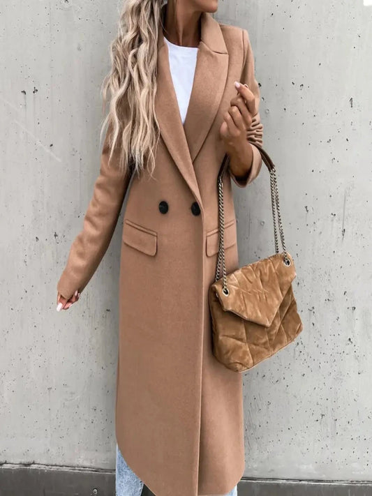 Discover the elegance of a Women's Long Blazer, an all-match, long-sleeved overcoat with a button placket that's perfect for winter. This suit-collar trench coat is a versatile addition to any wardrobe, exuding sophistication