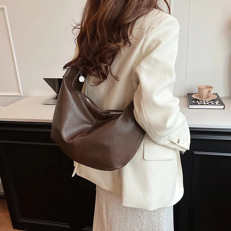 **"Chic Underarm, Messenger & Satchel Bag"**  
Curated for Tye Meshun's Boutique, this versatile square bag is perfect as a shoulder, satchel, or travel handbag. With a spacious interior and trend-forward design, it’s the u