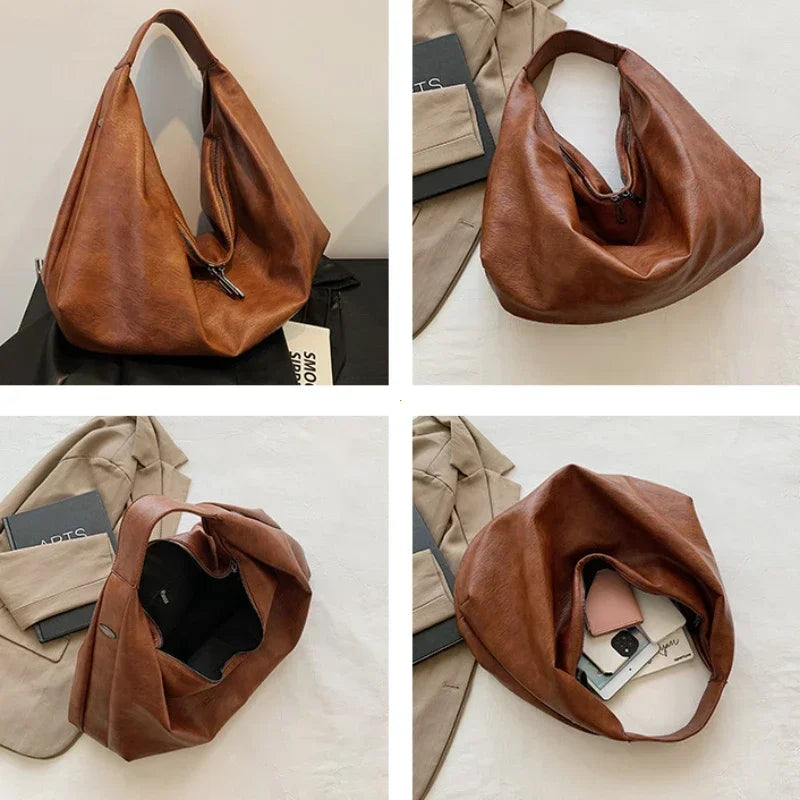 **"Bold Leather Shoulder Bag"**  
Add excitement to your everyday look with Tye Meshun's bold leather shoulder bag. Its roomy hobo design and luxurious craftsmanship make it as functional as it is stylish. Perfect for travel,