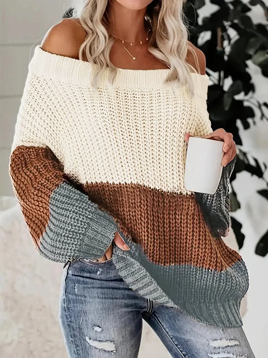 Bat sleeve sweater with color contrast, featuring a lined neck and off-the-shoulder design in a patchwork color contrast, loose-knit style.