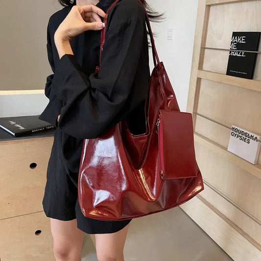 Thought for a couple of seconds "Women’s Retro-Inspired Tote Bag" Elevate your style with Tye Meshun's versatile tote. Crafted from soft PU leather, its spacious interior and underarm-friendly shape make it a perfect everyday companion.