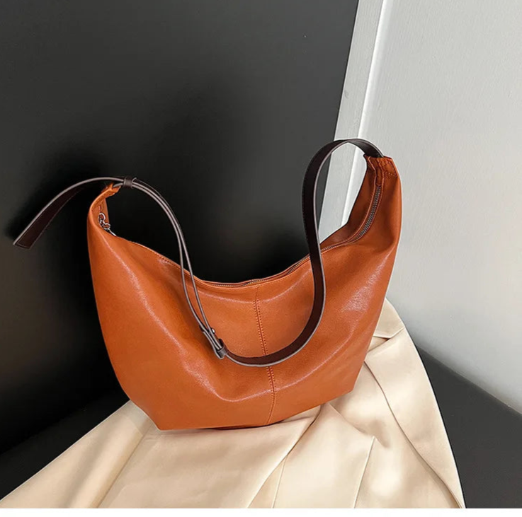 **"Chic Underarm, Messenger & Satchel Bag"**  
Curated for Tye Meshun's Boutique, this versatile square bag is perfect as a shoulder, satchel, or travel handbag. With a spacious interior and trend-forward design, it’s the u