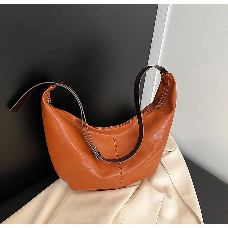 **"Chic Underarm, Messenger & Satchel Bag"**  
Curated for Tye Meshun's Boutique, this versatile square bag is perfect as a shoulder, satchel, or travel handbag. With a spacious interior and trend-forward design, it’s the u