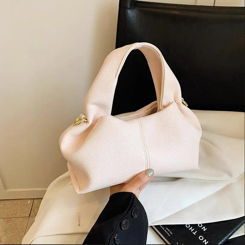 Here’s a season- and date-neutral version:

**"Women's Dumpling Shoulder Crossbody Bag"**  
Elevate your look with Tye Meshun's luxurious top-handle hobo bag. Featuring a chic "dumpling" silhouette, this versatile piece tra