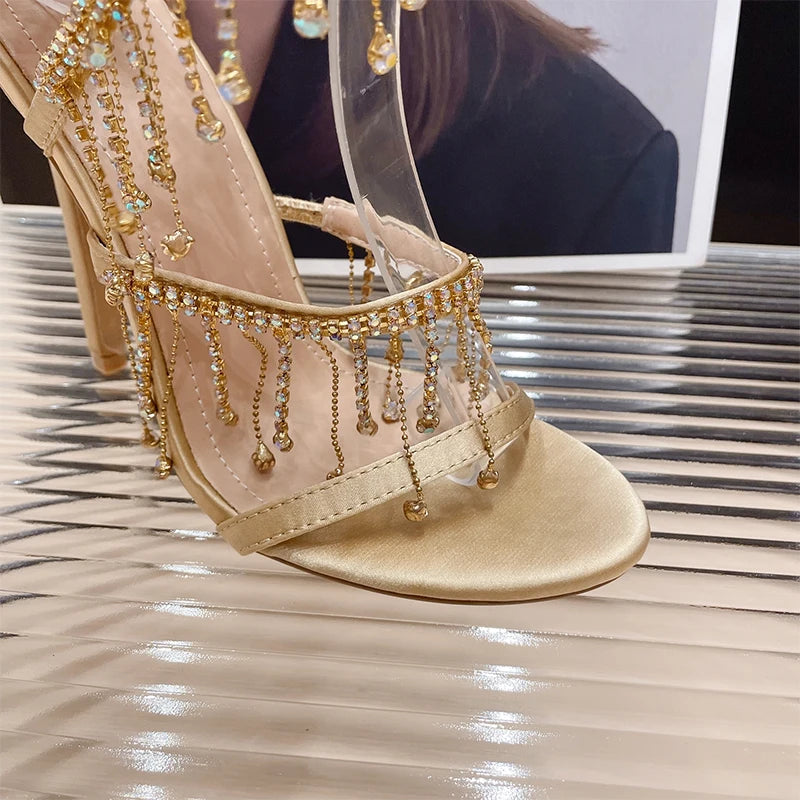 Discover the Aneikeh Fashion collection: dazzling rhinestone sandals with a string bead design, featuring a stiletto heel and wrap strap, complete with a peep toe for a touch of elegance.