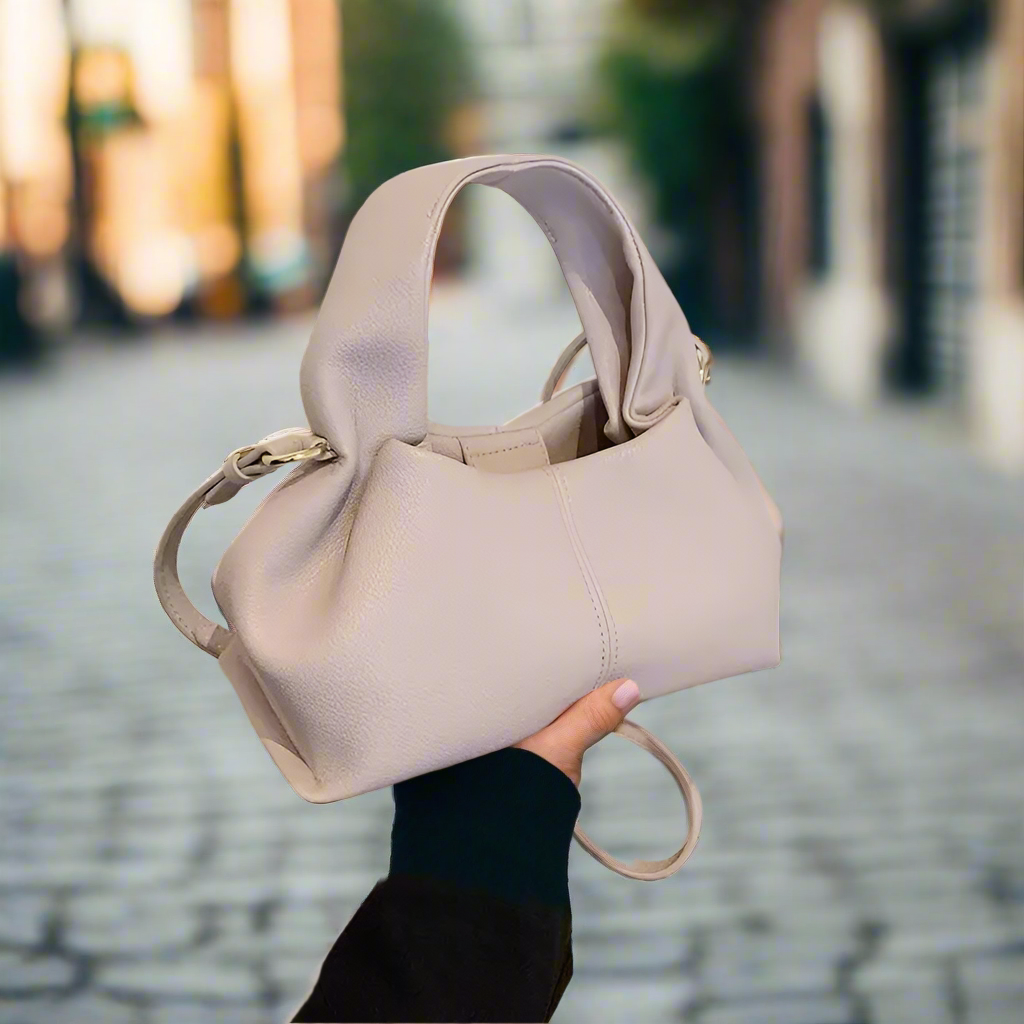 Here’s a season- and date-neutral version:

**"Women's Dumpling Shoulder Crossbody Bag"**  
Elevate your look with Tye Meshun's luxurious top-handle hobo bag. Featuring a chic "dumpling" silhouette, this versatile piece tra