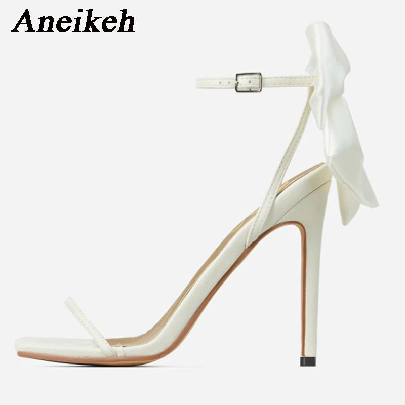 Discover the charm of Aneikeh Butterfly-Knot Sandals! With their sleek square toe, slender heels, and a minimalist yet sweet buckle strap, these open-toe sandals are the epitome of elegance. The pleated design adds a touch of