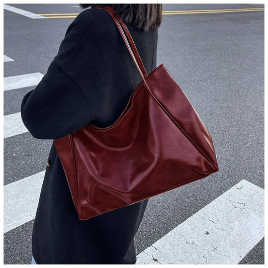 **"Women's Underarm Tote Bag"**  
Elevate your everyday style with Tye Meshun’s soft PU leather tote. Featuring a spacious interior, retro-inspired details, and versatile carry options—shoulder, crossbody, or hand-held—