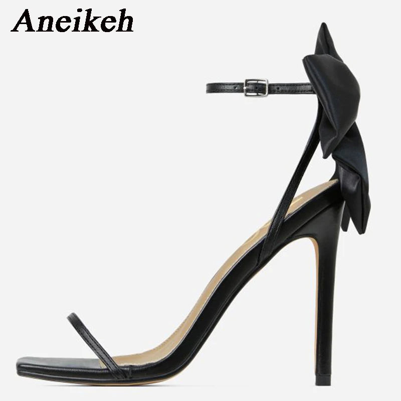 Discover the charm of Aneikeh Butterfly-Knot Sandals! With their sleek square toe, slender heels, and a minimalist yet sweet buckle strap, these open-toe sandals are the epitome of elegance. The pleated design adds a touch of