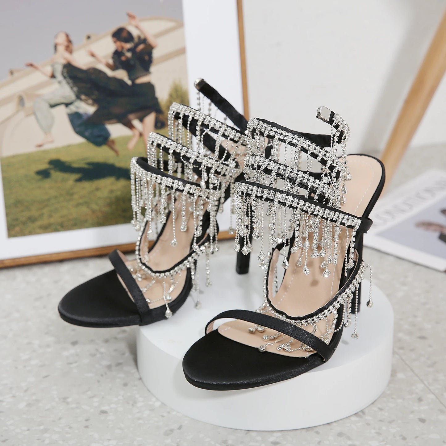 Discover the Aneikeh Fashion collection: dazzling rhinestone sandals with a string bead design, featuring a stiletto heel and wrap strap, complete with a peep toe for a touch of elegance.