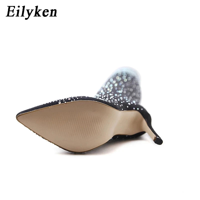 Eilyken Design features crystal rhinestone-adorned, stretch fabric high heels that are both sexy and elegant. These over-the-knee boots with a pointed toe silhouette are a statement piece for any wardrobe.