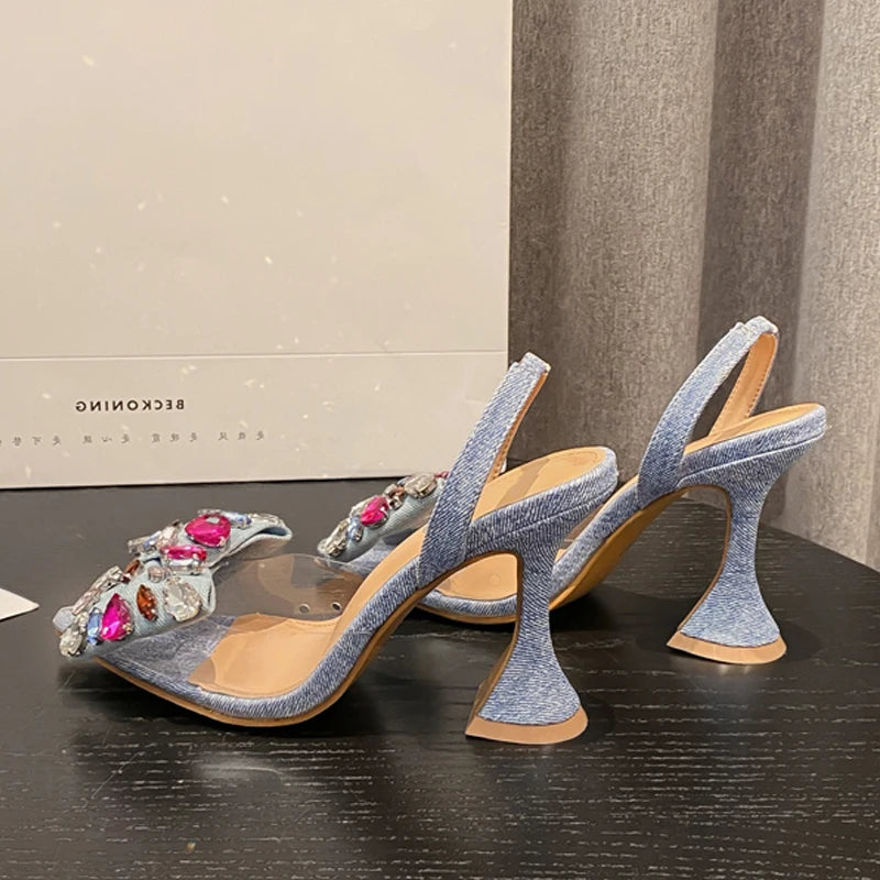 Discover the allure of Eilyken Fashion's Denim Bowknot Crystal Pumps, where sexy meets sophistication. These high heels feature a sleek pointed toe design, adorned with a charming bowknot and sparkling crystals, perfect for t